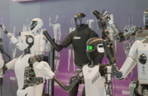 a gallery of humanoid robots from different manufacturers wave to the crowd.