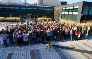 Attendees pose outside Boston Dynamics headquarters for MassRobotics Women in Robotics event in September 2024.