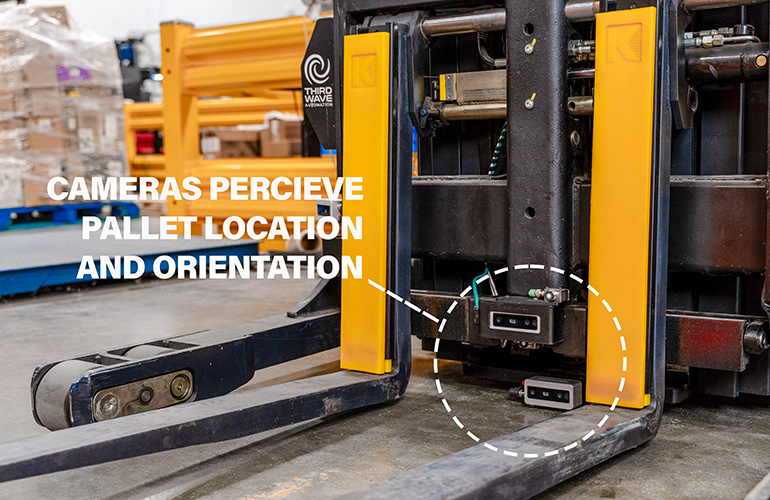 close up image front of forklift, showing location of camera to sense the pallat location.