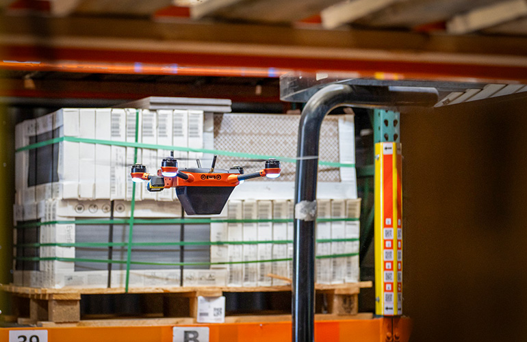 drone flying in a warehouse.